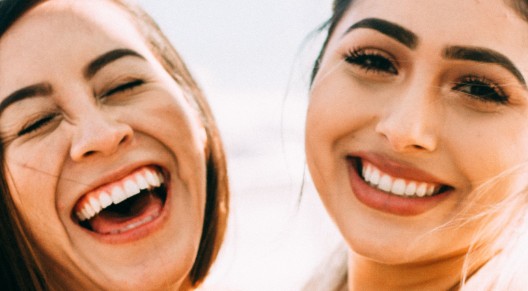 two smiling women