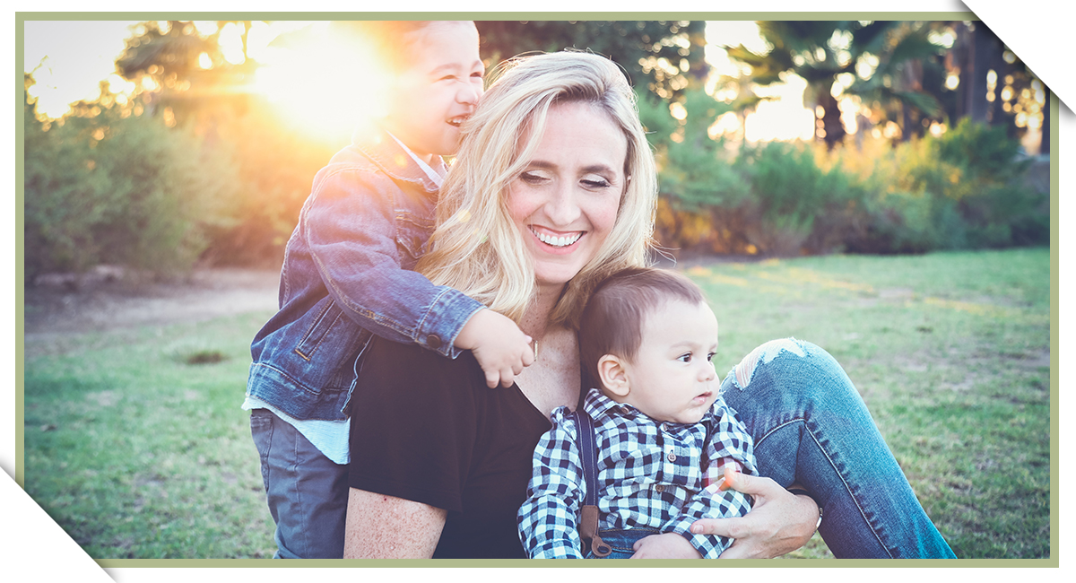 Image of a mother and kids smiling