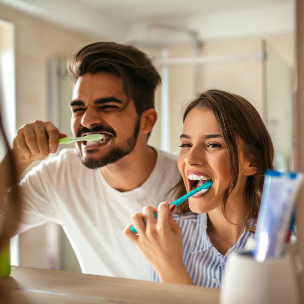 couple brushing their teeth