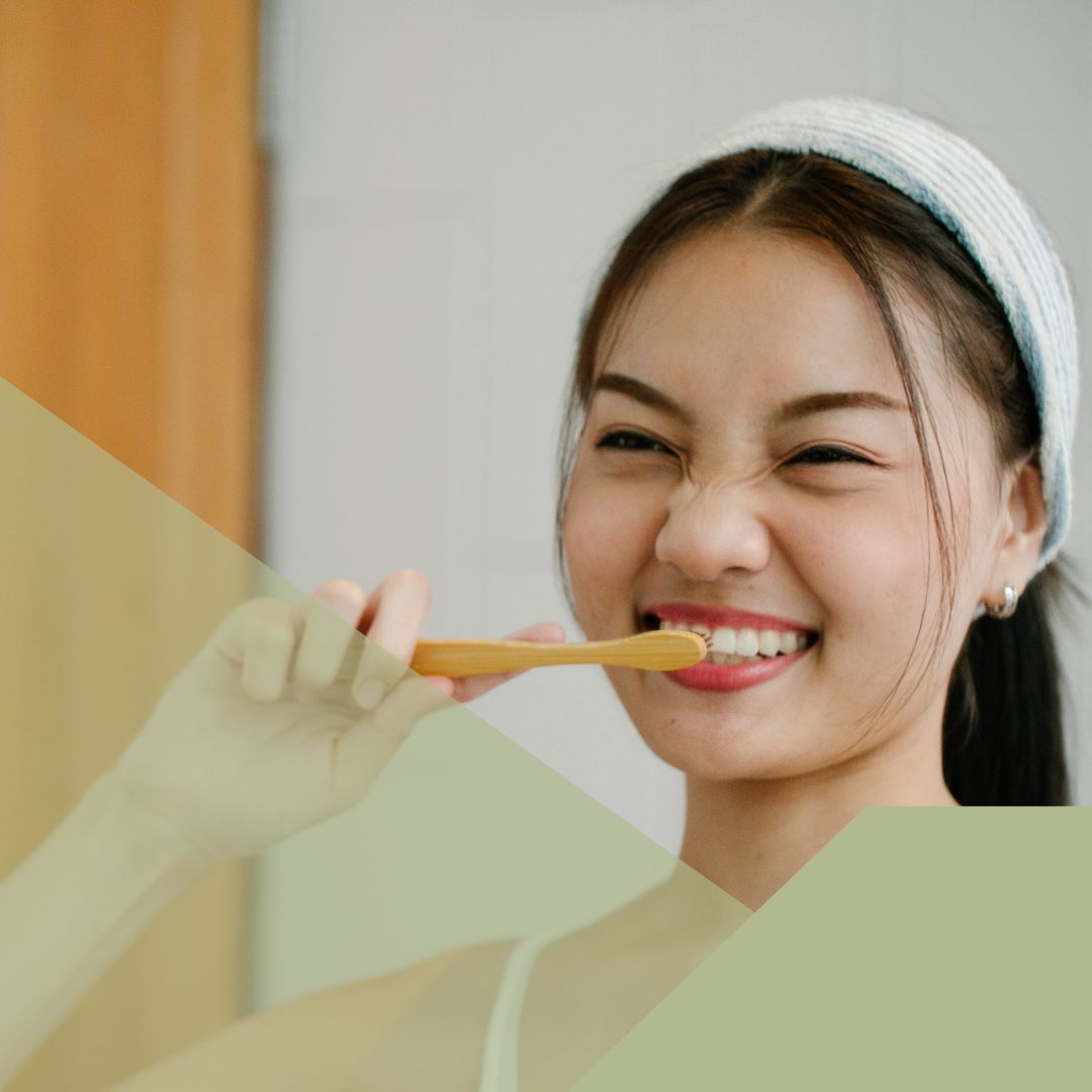 smiling woman brushing teeth