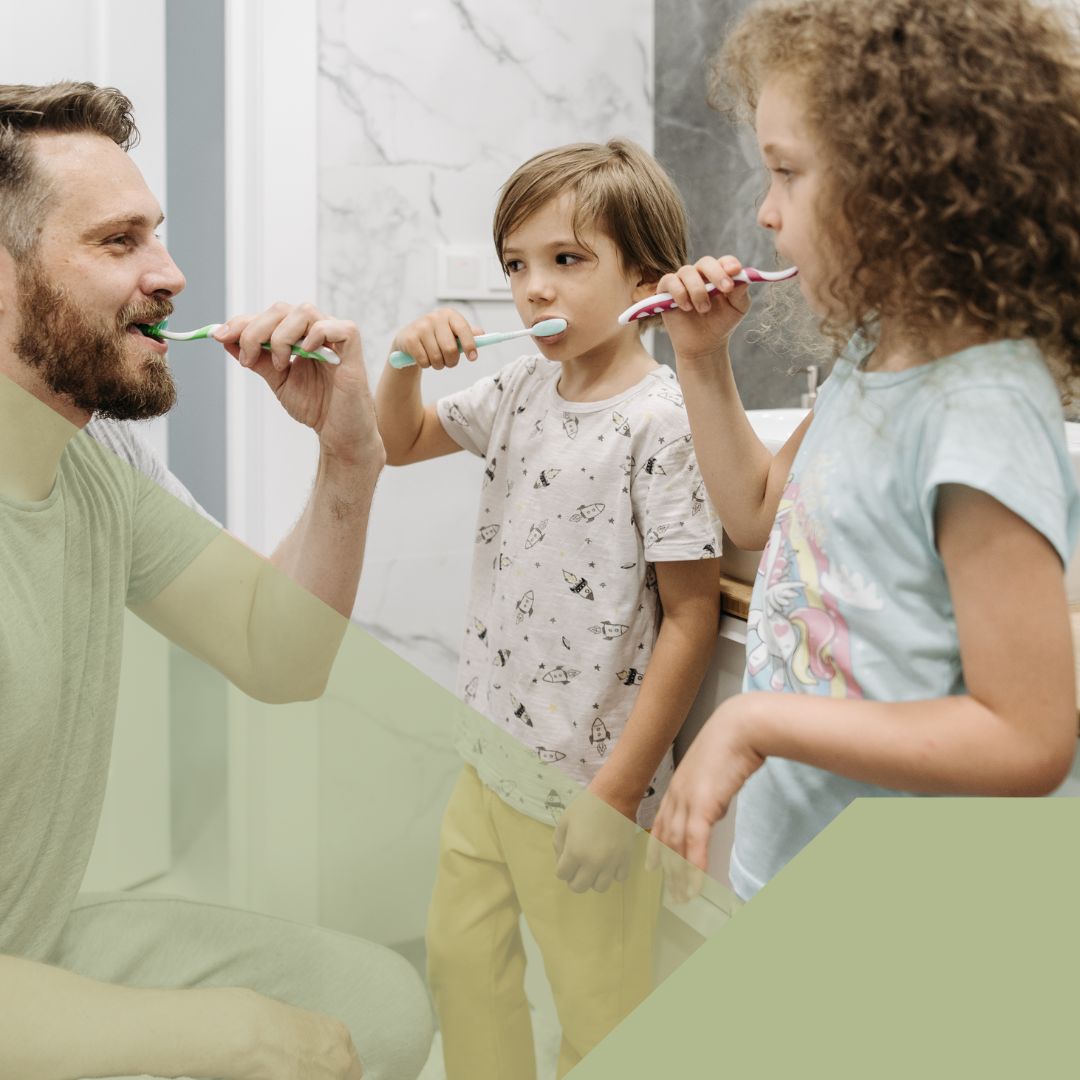 kids brushing teeth with parent