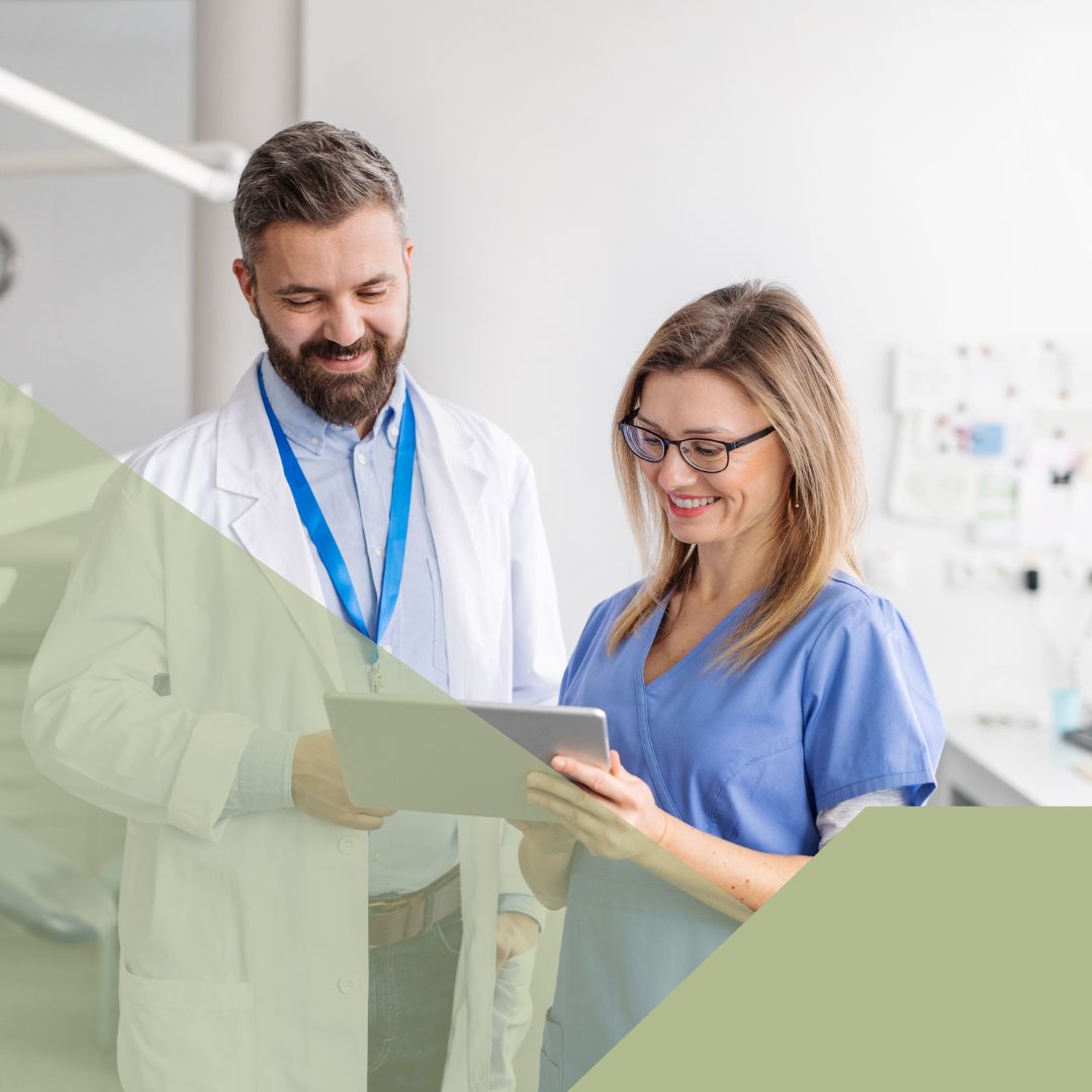 two dental staff discussing care