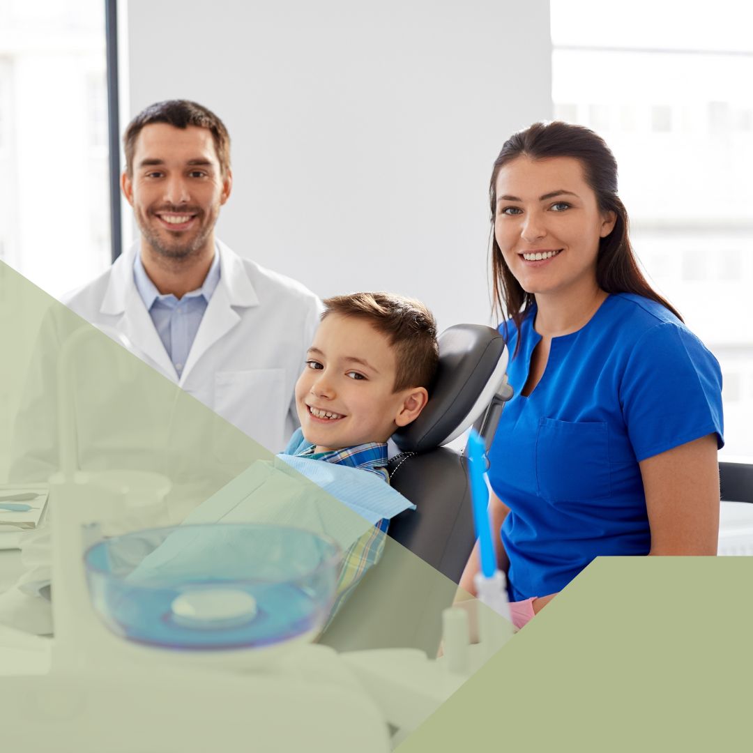 dental staff with little boy at dentist