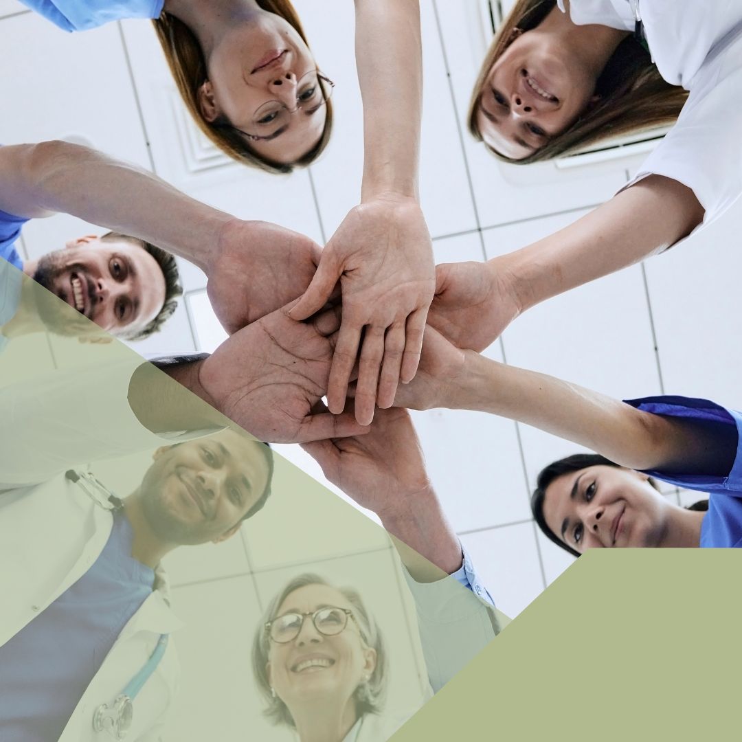 dental staff putting hands together in a pile