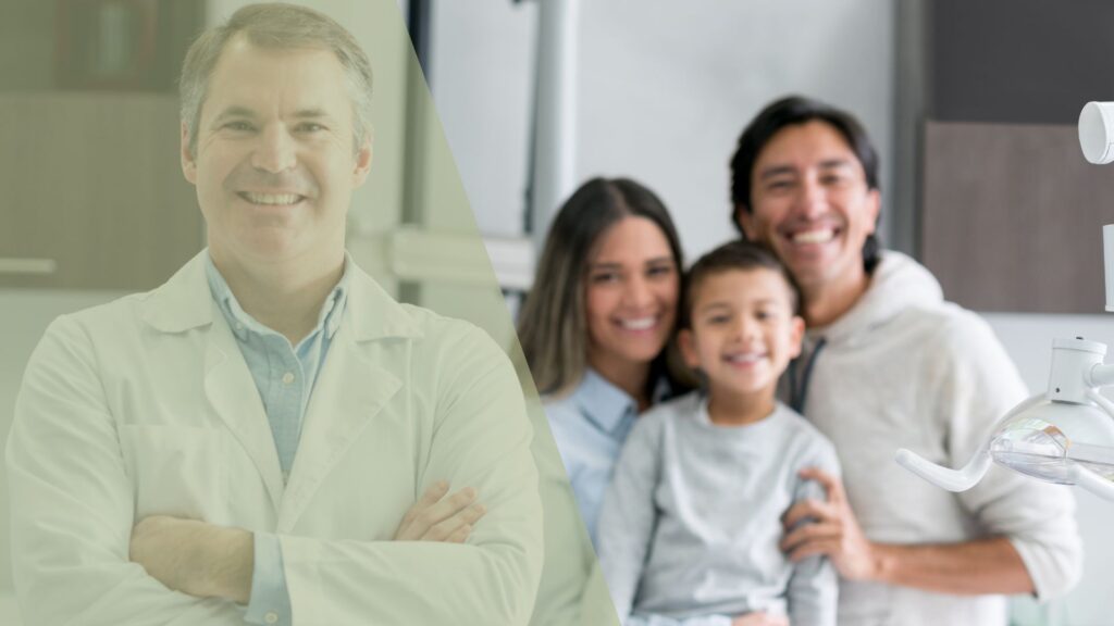 smiling family standing with a dentist