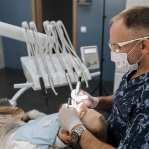 man getting his teeth cleaned