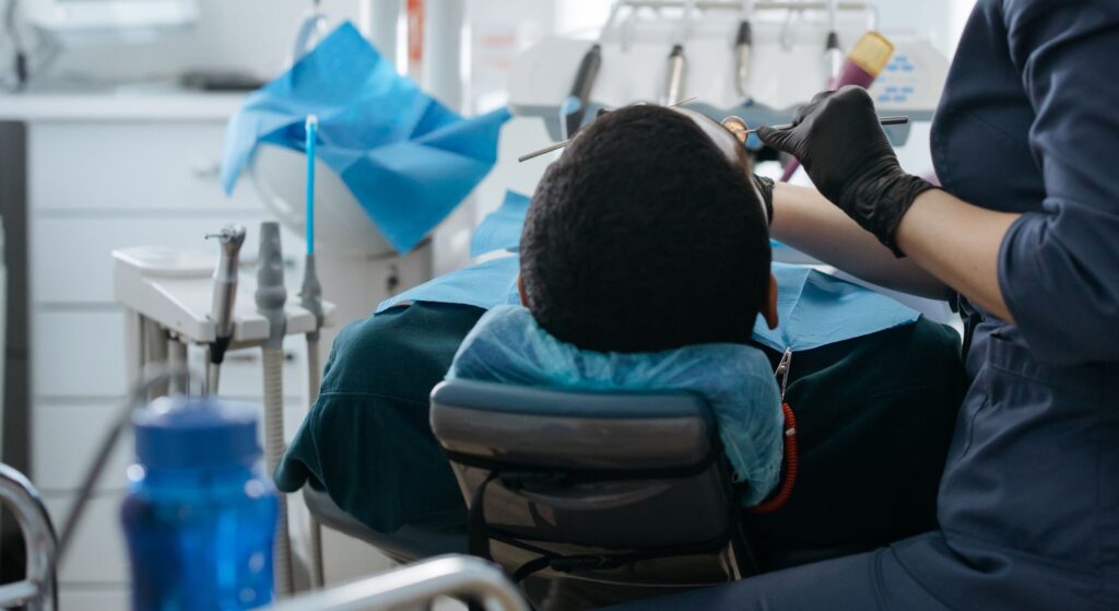 man laying down in dentist chair