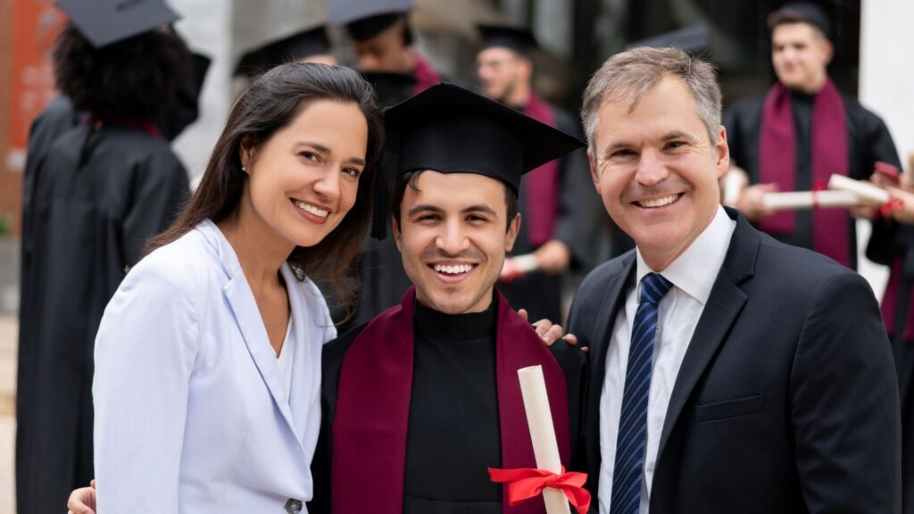 family smiling at graduation